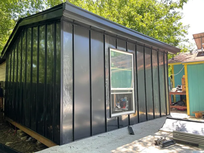 Black standing seam metal wall panels for Roof Inspection in Dudley